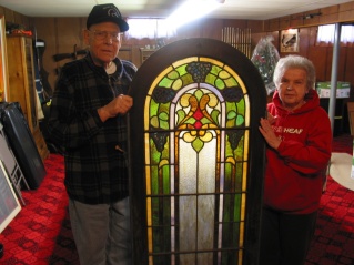 David and Mary Hanneman with a section of stained glass window on the day the windows were picked up for use at St. Mary's Hospital.